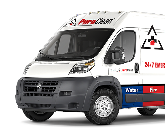 A white PuroClean emergency restoration van displays "Water" and "Fire" services on