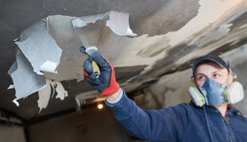 fire damage restoration indoor interior. removing damaged paint layer