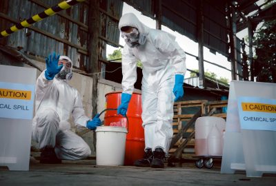 biohazard cleanup technicians wearing protective suits inside residential property Atlanta Georgia