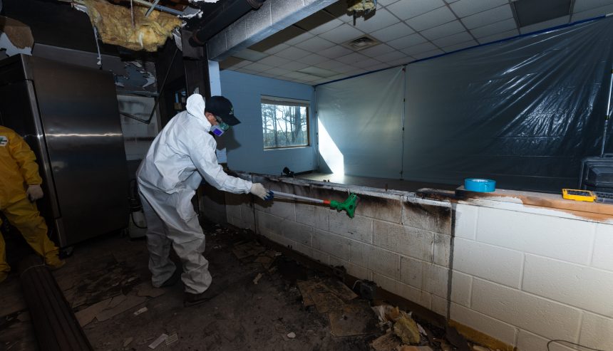 fire damage restoration technicians working inside residential home Hapeville Georgia