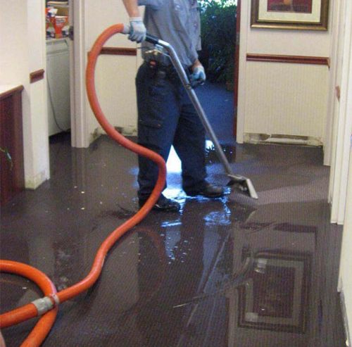 water restoration technicians working inside residential home Atlanta Georgia