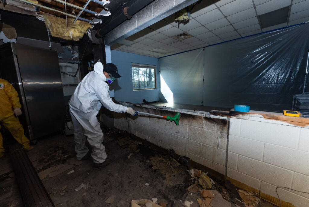 fire damage restoration technicians working inside residential home Hapeville Georgia