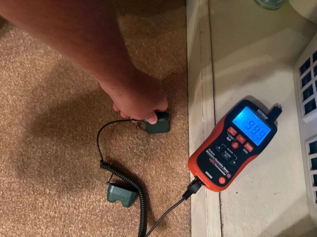 The soaked carpet caused by the burst sink supply line.
