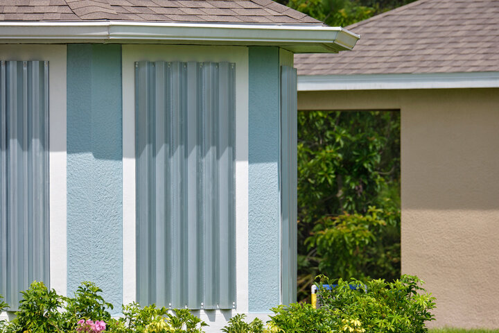 Preparing for a Houston hurricane includes boarding up windows securely with shutters