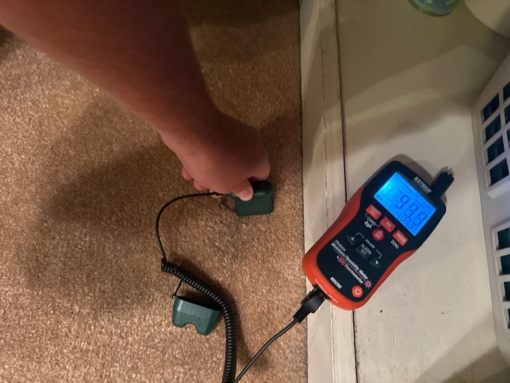 The soaked carpet caused by the burst sink supply line.