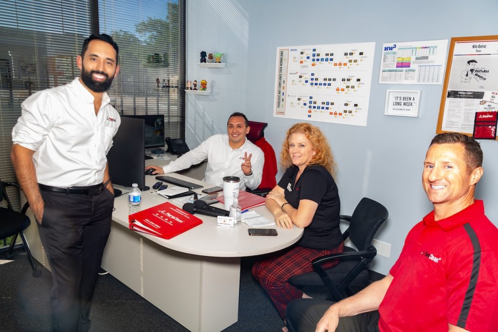 Nilo Quiroz is working with PuroClean members in an interactive workshop during the Commercial Sales class.