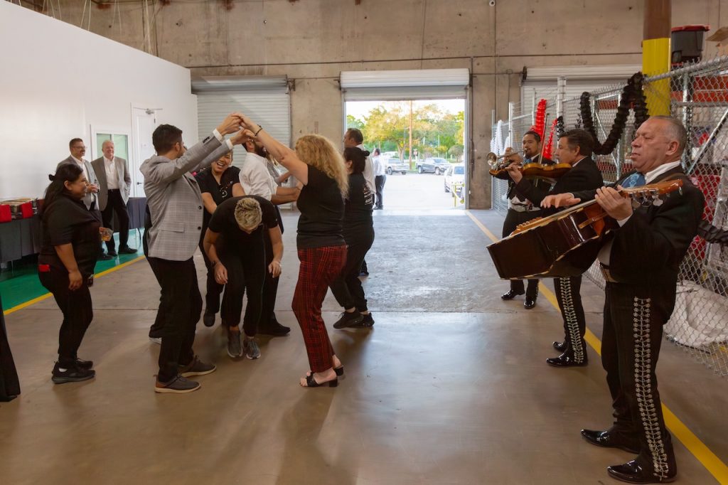 PuroClean members celebrate with some mariachi music after a successful workshop.