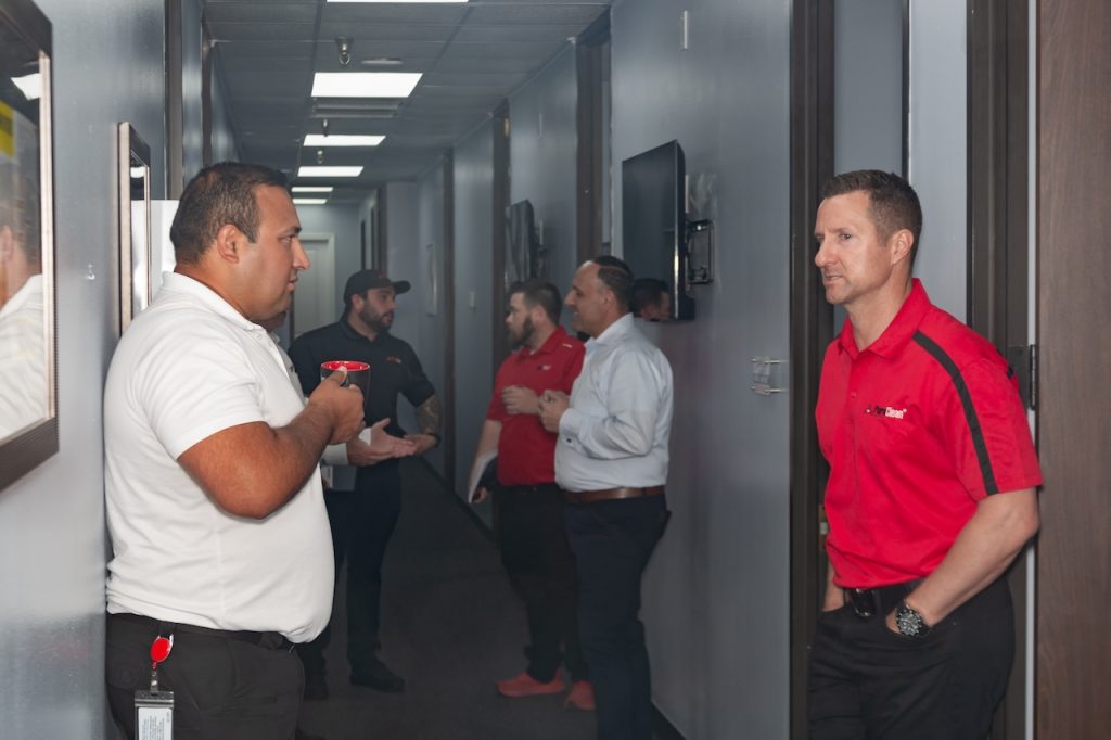 John Villon of PuroClean Houston/Sugar Land/Province discussing sales techniques with team members.