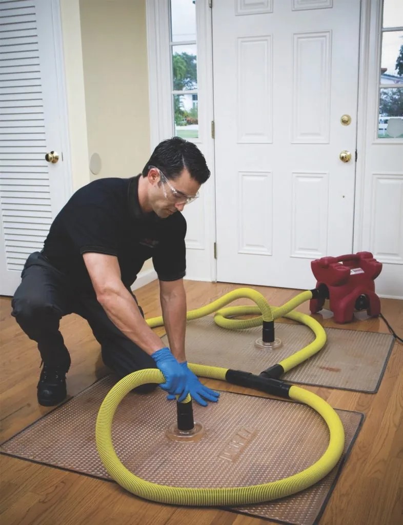 puroclean technician removing all categories of water from a home in long island