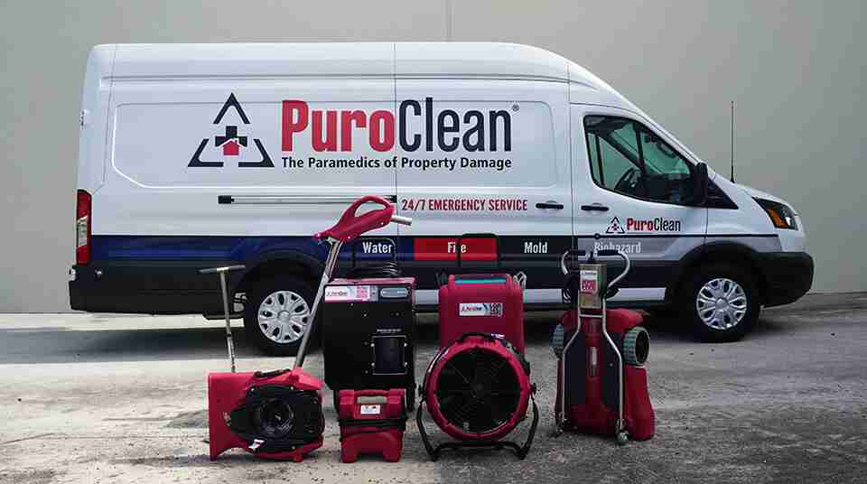 equiptment in front of a puroclean van. puroclean is a smart broker and agents trusted restoration partner