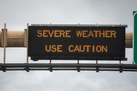Use caution sign on highway in long island. Springtime rain