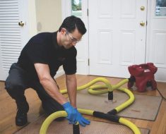 puroclean technician removing all categories of water from a home in long island