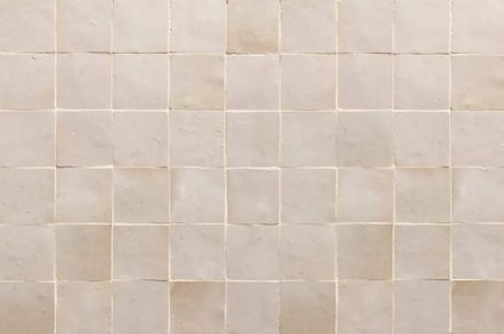 Tile on a bathroom wall. Water damage can occure to tiles if they are not sealed properly and are not set right.