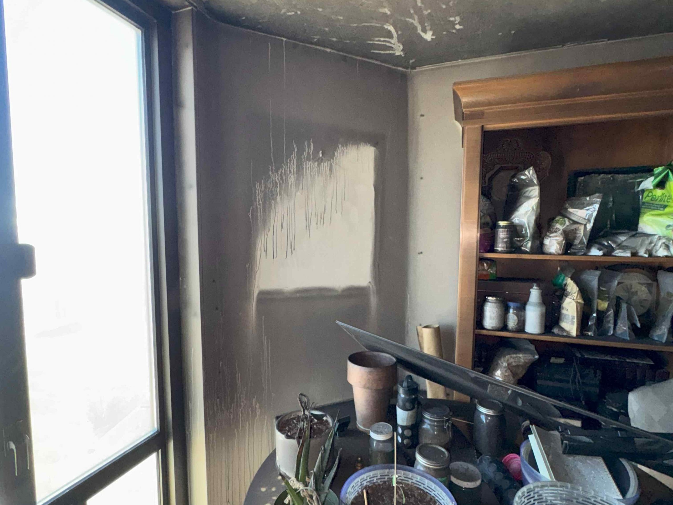 soot damage from a fire in a nearby room in the same house
