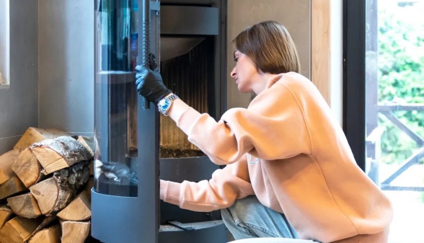 woman cleaning fireplace in her long island home