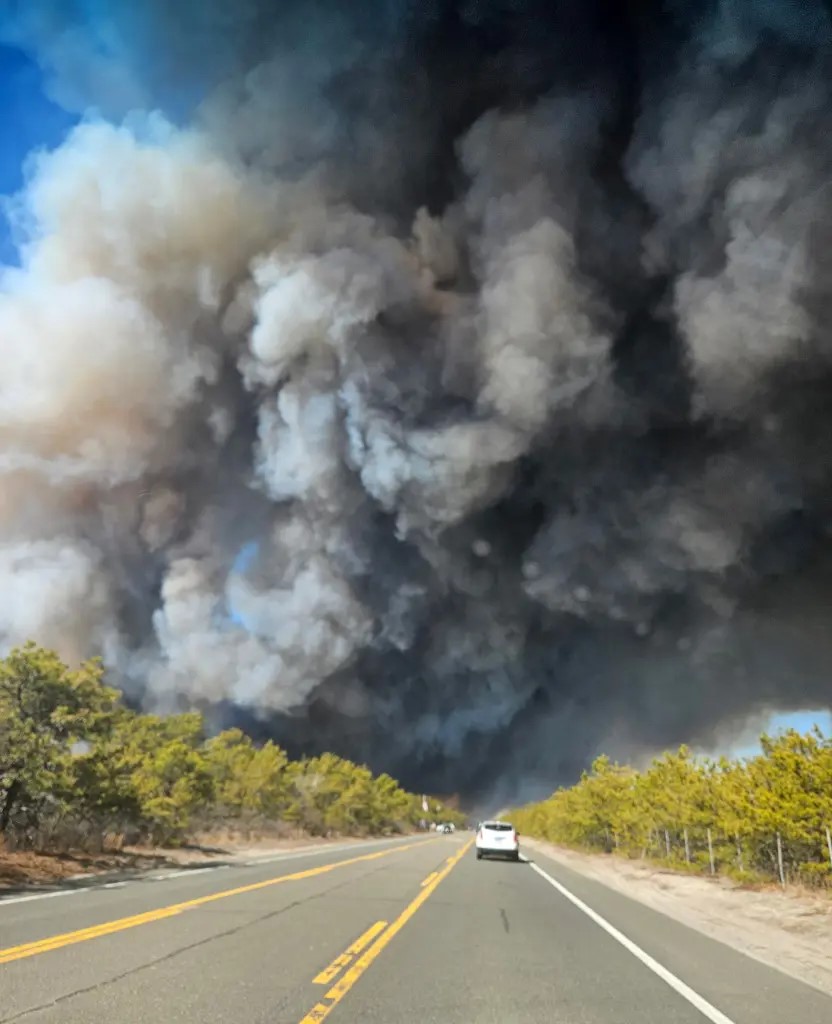 Wild fires spread across eastern long island sending smoke and soot across the state