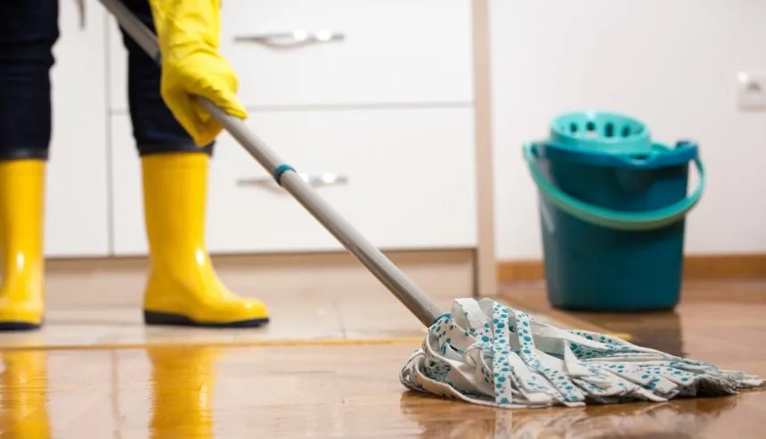 Mopping a floor that had a sewage spill