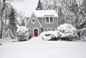Long Island home in winter with ice dams and snow on the roof | PuroClean of Huntington