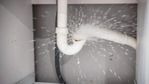 Burst water pipe under sink