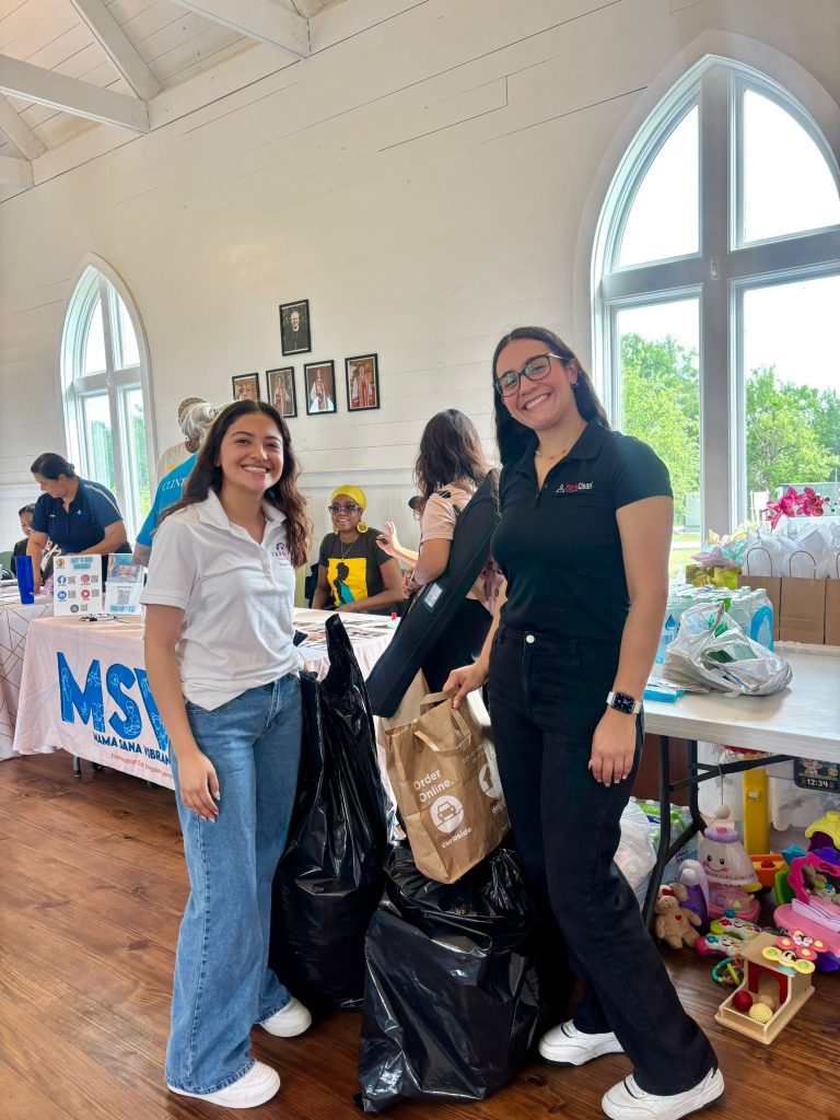 PuroClean of Hutto & Manor team at their vendor table during the Community Baby Shower