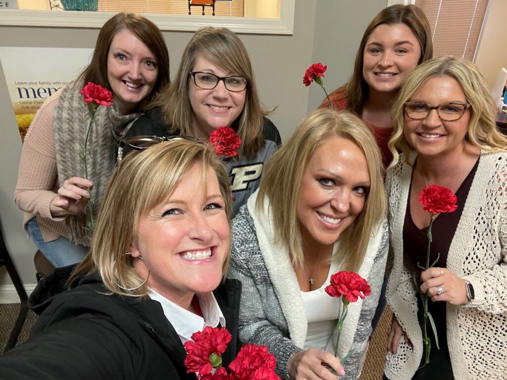 Insurance agent partners at Amber-Fields Hatten Insurance office.