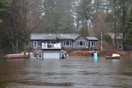 Flooded home. Spring flooding prevention is important during the months between winter and summer.