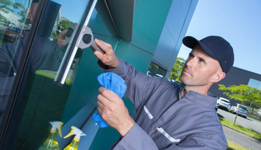 man performing spring maintenance cleaning