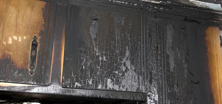 Soot damaged kitchen cabnits