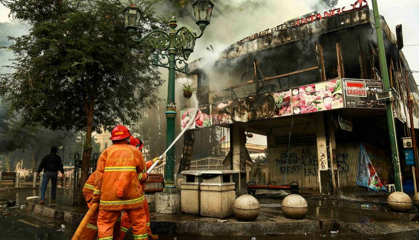 fire damage and restoration in winston-salem | experts puting out a fire