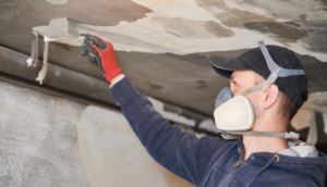 Professional Scraping Ceiling during fire damage restoration