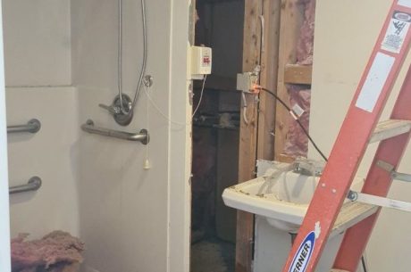 Water damage in bathroom caused by burst pipe.