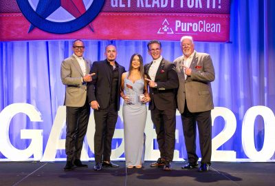 PuroClean NJ owners receiving Franchise of the Year 2024 award