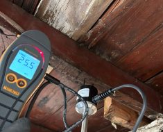 Water mitigation in Long Beach, invasive moisture meter shows the structural wood behind the drywall was saturated with moisture.