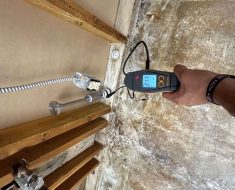 water mitigation, irvine, meter showing high moisture