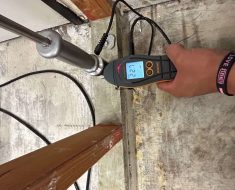water mitigation, irvine, meter showing high moisture in base plate