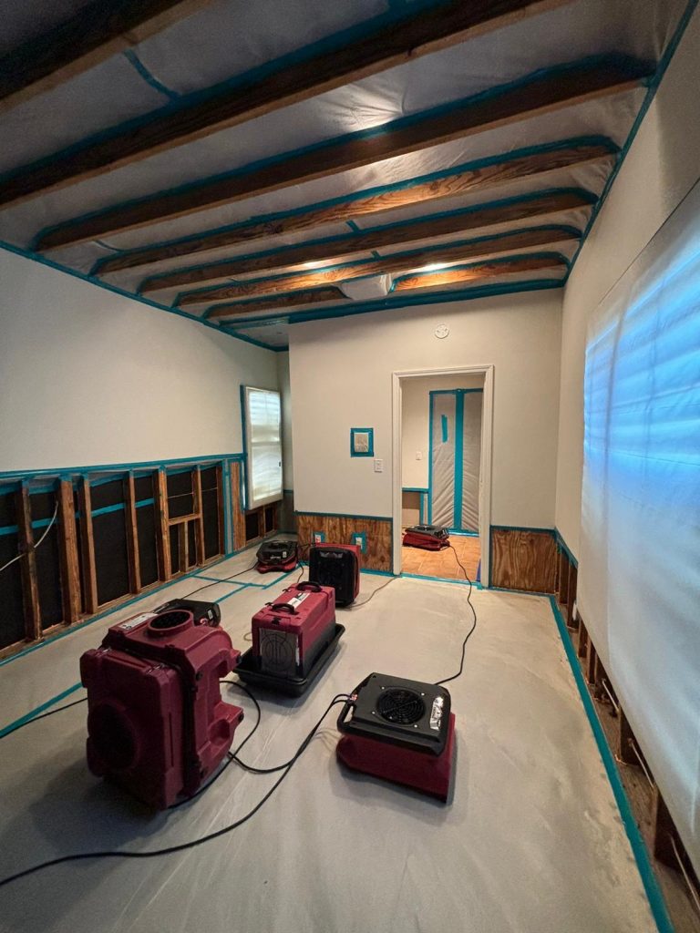 Dehumidifiers, air movers and an air scrubber at a water remediation loss.