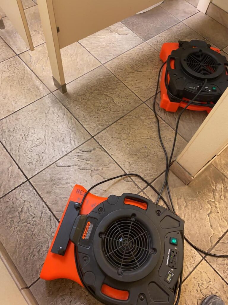 drying equipment set up during water damage restoration from overflowing toilet.