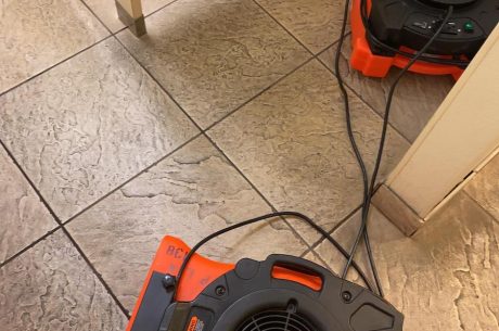 drying equipment set up during water damage restoration from overflowing toilet.