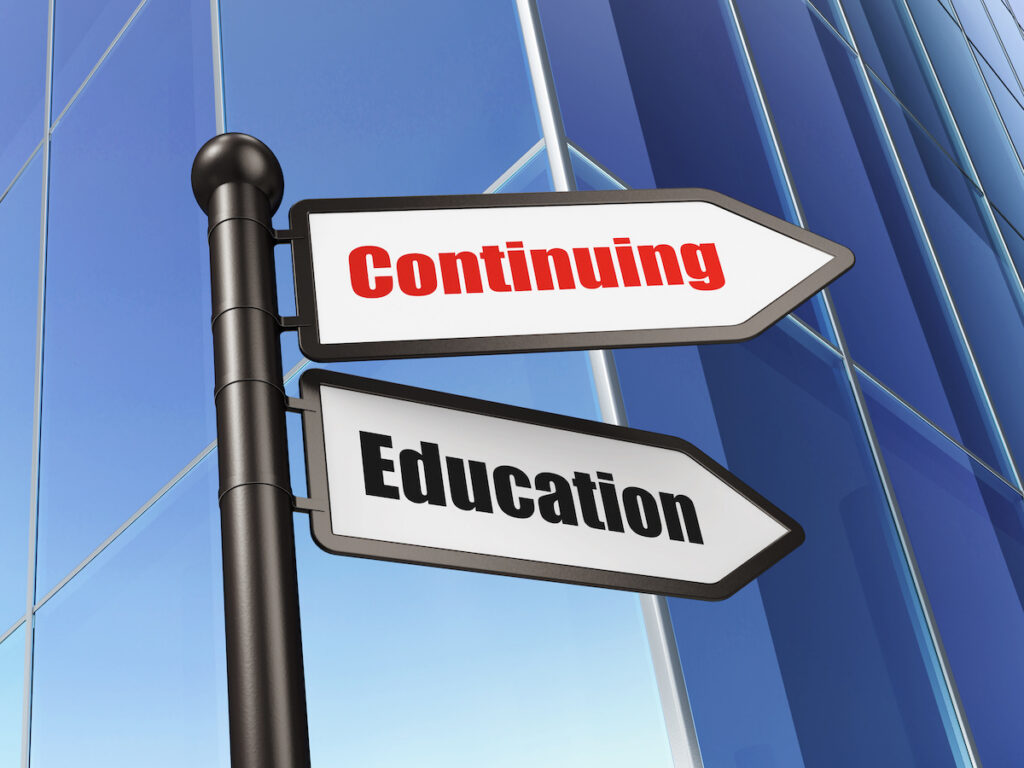 street pole with two signs saying continuing education