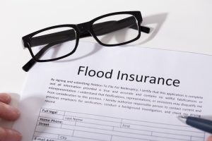 A photo depicting a flood insurance policy