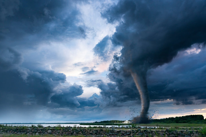 A tornado is formed when a column of air extends from a thunderstorm and comes in contact with the ground, supporting an updraft.