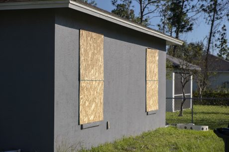 Plywood storm shutters mounted for hurricane protection