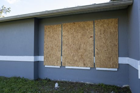 Plywood storm shutters for hurricane protection