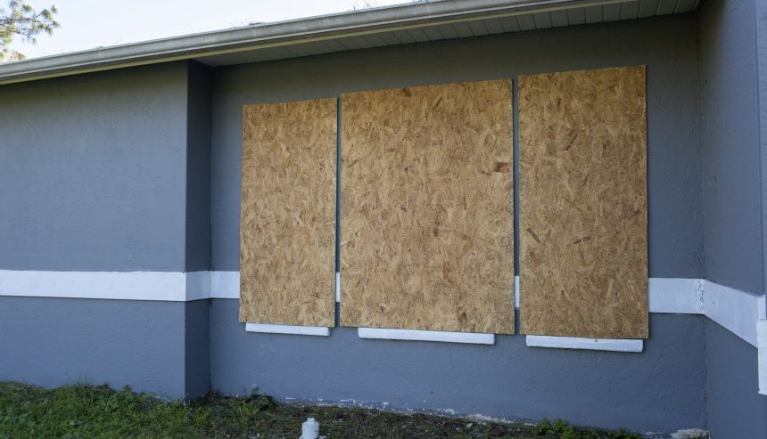 Plywood storm shutters for hurricane protection