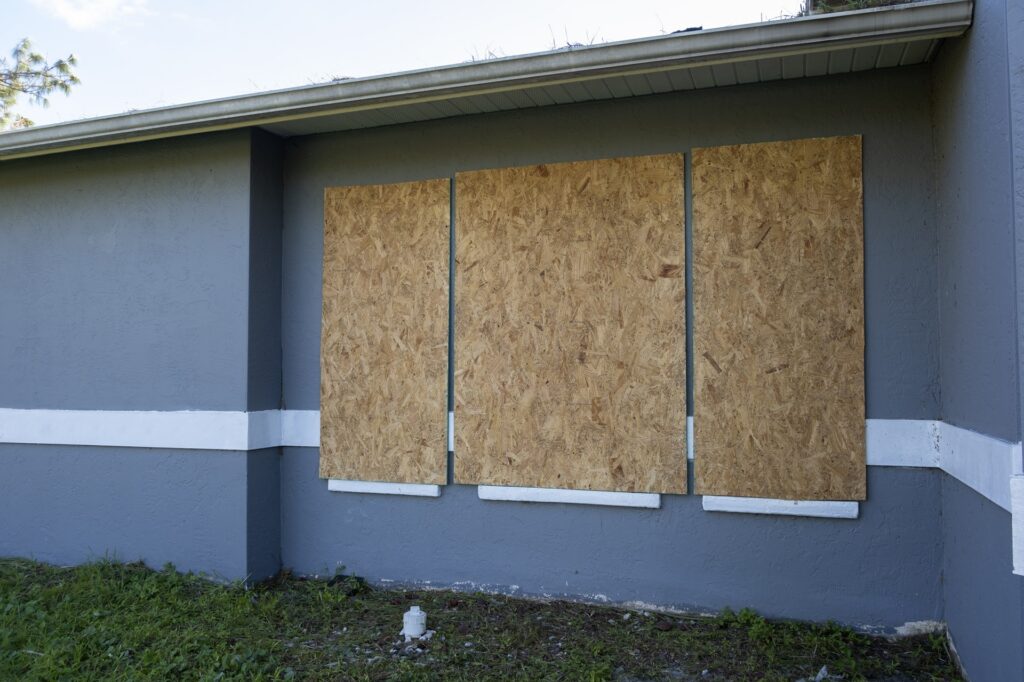 Plywood storm shutters for hurricane protection