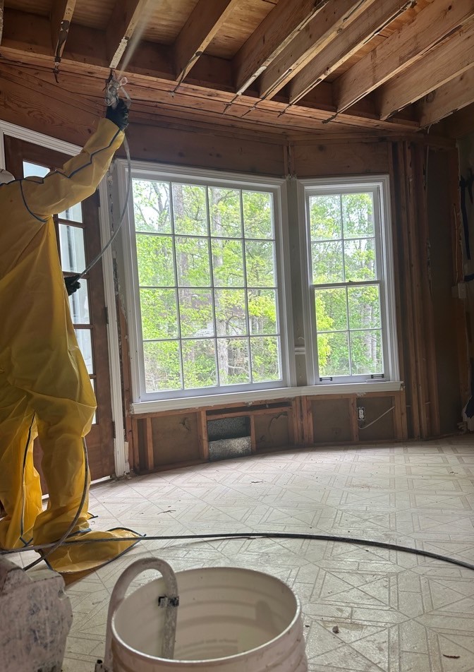 Fire-damaged breakfast nook stripped to open ceiling joists during PuroClean of East Cobb fire restoration in Peachtree Corners