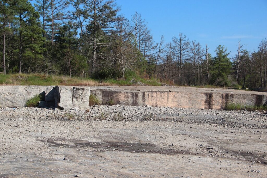 Cut granite face at the Arabia Mountain quarry near Lithonia — the exposed stone terrain that sheds rainwater quickly into local creeks and the South River