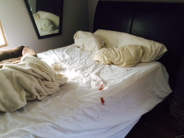 Blood on bed and sheets from a crime scene cleanup