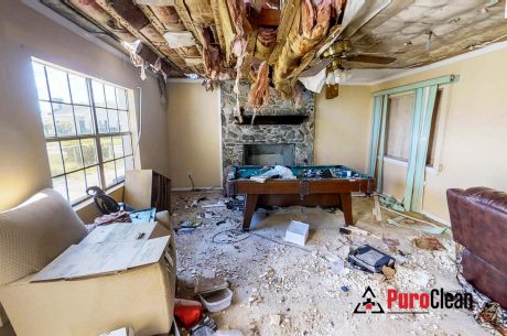 charred living room ready for cleanup after a fire