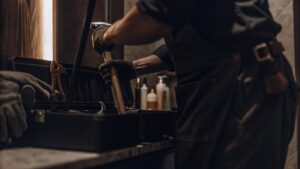 Technician using protective gear while handling equipment, showing professional mold services compared to DIY mold removal methods